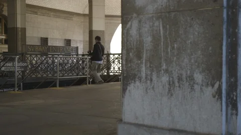 Man Walking Down Stairs at Subway Entrance Video stock 121289606