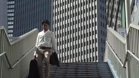Man walking down stairs, Tokyo Stock Footage 74168521