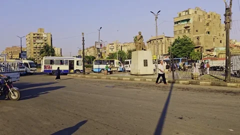 A man walking down a street with a box Stock Footage 292243692