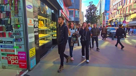 A man walking down a street with a cell in his hand Stock Footage 273009602