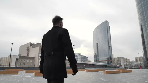 Man walking down the street Stock Footage 103795613