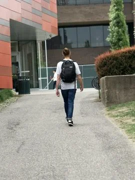 Man Walking Down a Street Stock Photos