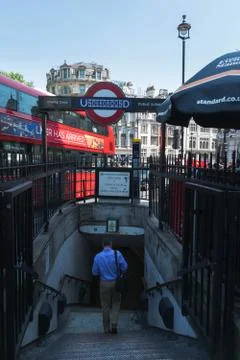 Man walking down into subway 库存照片