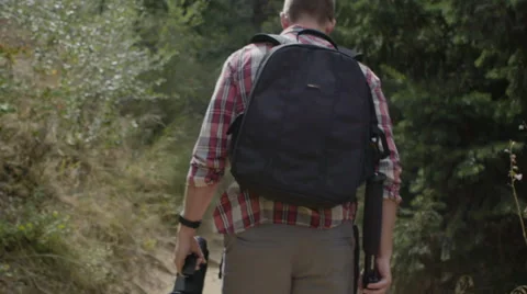 Man walking down trail Stock Footage 54707226