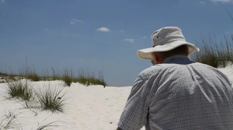 Man Walking Up Dune Stock Footage 5296497