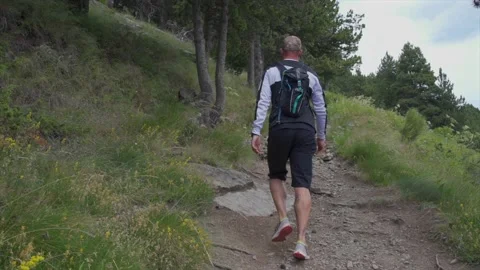 Man walking on the empty mountain road Video stock 158626577
