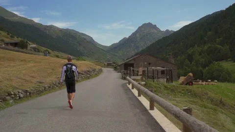 Man walking on the empty mountain road Video stock 158632728