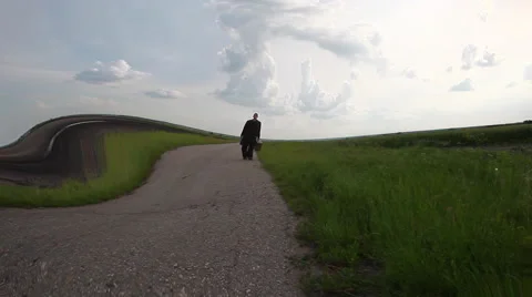 Man walking on the empty road with water effect Stock Footage 40079294