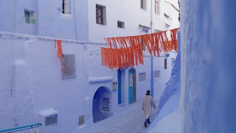 Man walking on empty street of Chefchaouen, Morocco Stock Footage 265496901