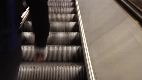 Man walking up escalator. Stock Footage 258670422