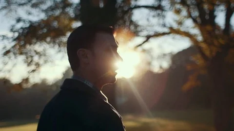 Man Walking Exhales During Cool Morning Sunrise Stock Footage 81492076