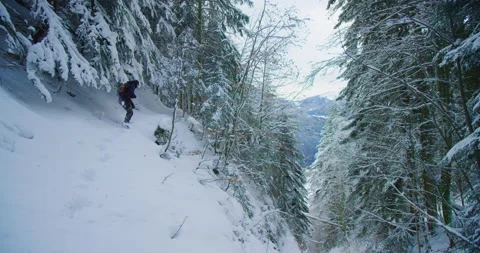 A man is walking up an exposed path in a... | Stock Video | Pond5