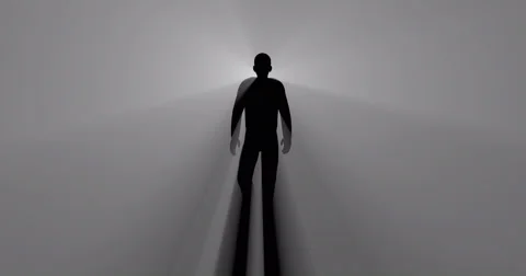 Man walking in fog  with light rays and shadows emitted from behind Video stock 68103828