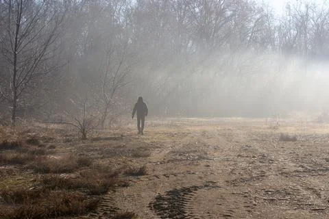 Man walking in the fog Stock Photos