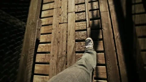 Man Walking on a footbridge Stock Footage 12656903