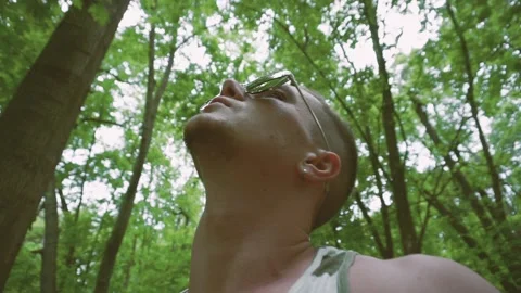 Man is walking in forest Видео 89522684