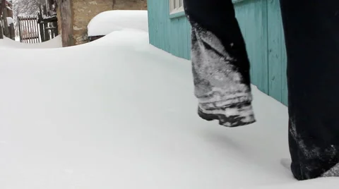 Man walking forward in deep snow - rural scene Stock Footage 1085585