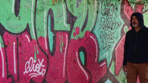 The man walking in front of a graffiti - 4K - ProRes Stock Footage 162839344