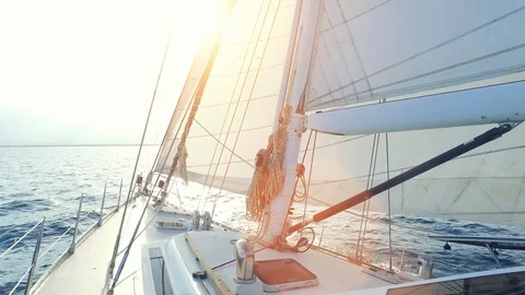 Man walking to the front of his sailing yacht. Stock Footage