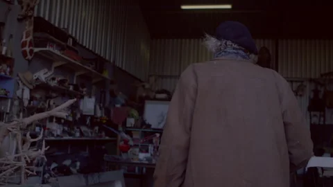 Man walking into a garage Stock Footage 278996534