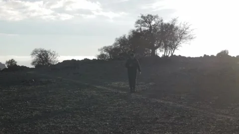 Man Walking in Golden Backlight, Ait Issafen, Morocco Stock-Footage 332770304