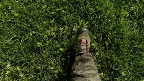Man Walking on Grass POV Stock Footage 139798485