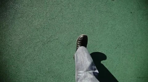 Man Walking on green texture Stock Footage 12656438