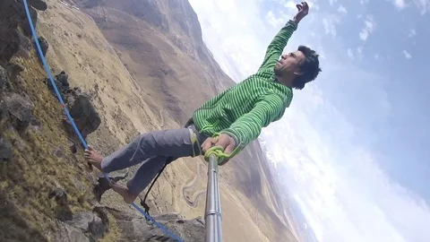 Man walking on high-wire Stock Footage 70218559