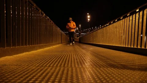 Man walking with his cell at night Stock Footage 104123444