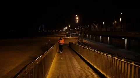 Man walking with his cell at night Stock Footage 104123446