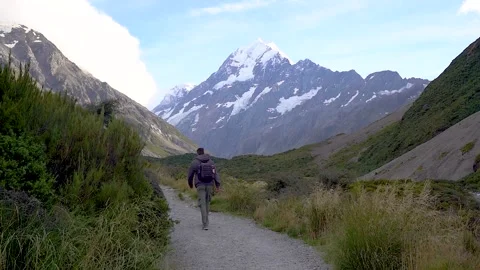 Man walking the Hooker Valley Track in the Mt Cook Aoraki/Mount Cook National Stock Footage 318081094