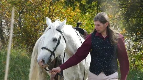 Man walking with horse 8 Stock Footage 82082172