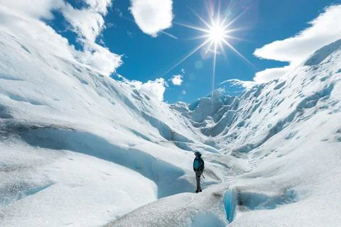 A man walking on the ice formation of the Perito Moreno Glacier Stock Photos