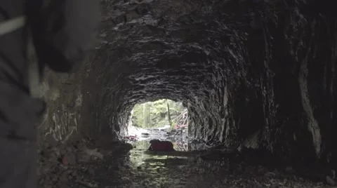 Man is walking inside of the cave Stock Footage 52850378