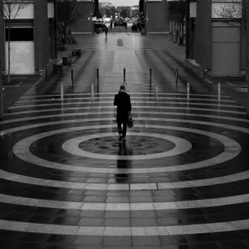 Man walking inside a circle. Stock Photos