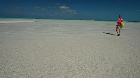 Man walking in the lagoon Stock Footage 133799520