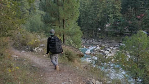 Man walking by lake trees backpacker 4K Footage UHD ProRess 422 25p Video stock 98665763