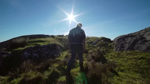 Man walking. With light house. 4k Stock Footage 77973216