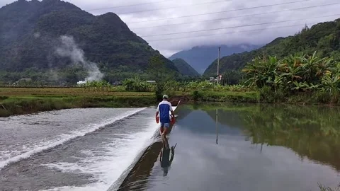Man Walking on Low Dam Crest Stock Footage 340935002