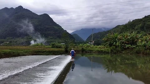 Man Walking on Low Dam Crest Stock Footage 340935004