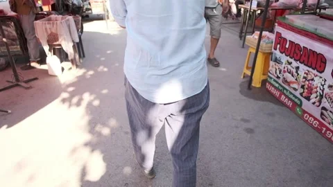 Man Walking in Market Stock Footage 146437216