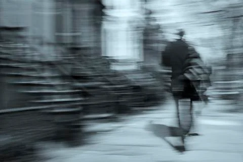 Man walking motion blur Stock Photos