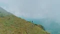 The man walking on the mountain on the foggy background 4k or 4k+ Resolution