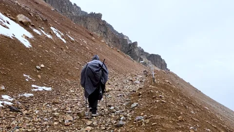 MAN WALKING IN A MOUNTAIN Stock Footage 327615152