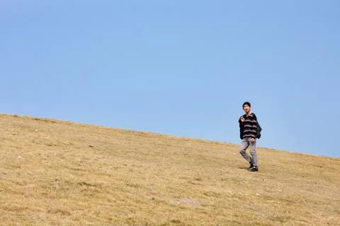 Man walking on the mountain Stock Photos