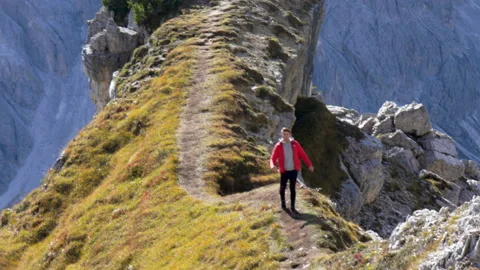 Man walking on mountain ridge epic drone view dolomites. Stock Footage 143364686