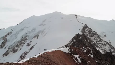 Man walking at the mountain summit aerial landscape Stock Footage 171226529