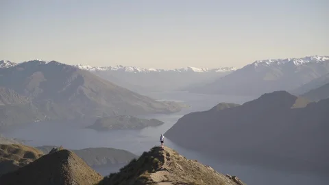 Man walking on the mountain top Stock Footage 95014692