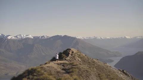 Man walking on the mountain top Stock Footage 95014857