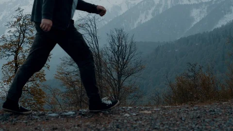 Man walking in the mountains Stock Footage 108035305